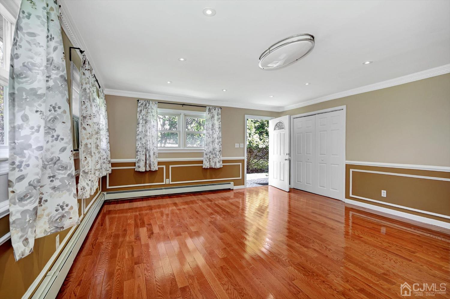 481 Plainfield Road Edison, NJ 08820 - Photo 37 of 42 a view of empty room with wooden floor and fan