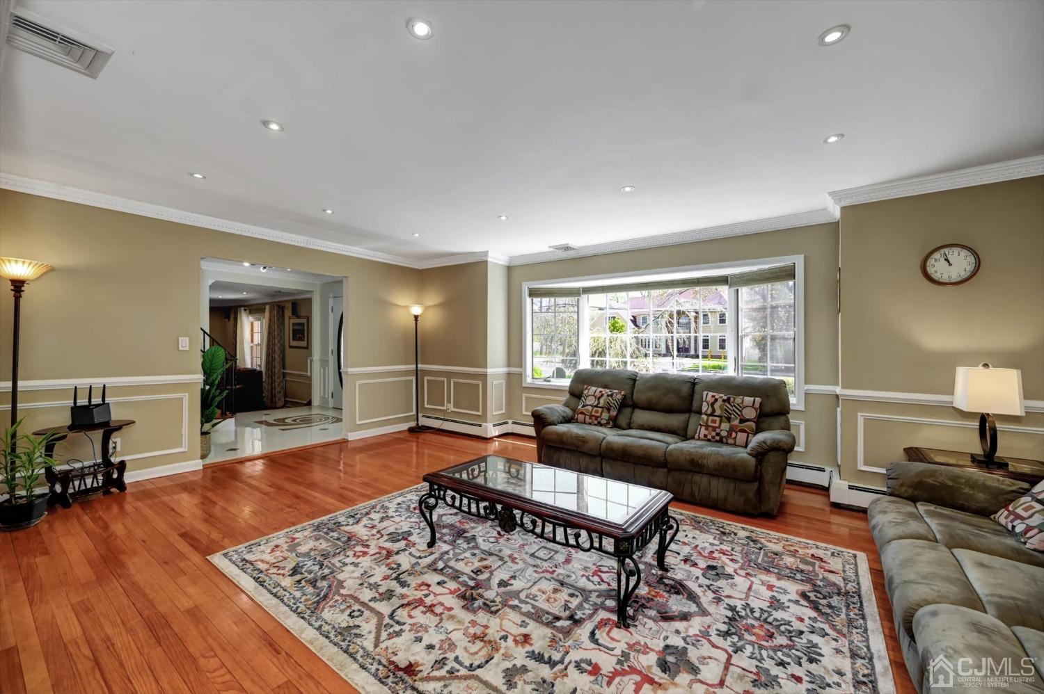 481 Plainfield Road Edison, NJ 08820 - Photo 10 of 42 a living room with furniture and wooden floor
