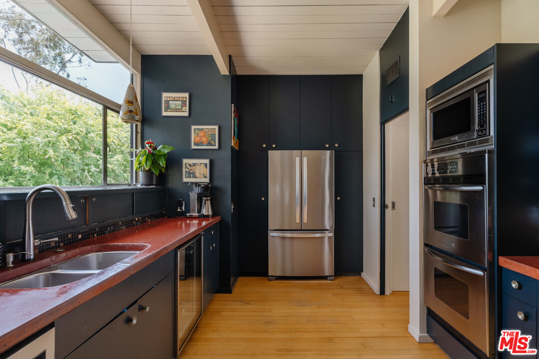 2980 Edgewick Road Glendale, CA 91206 - Photo 15 of 34 a kitchen with stainless steel appliances granite countertop a refrigerator and a sink