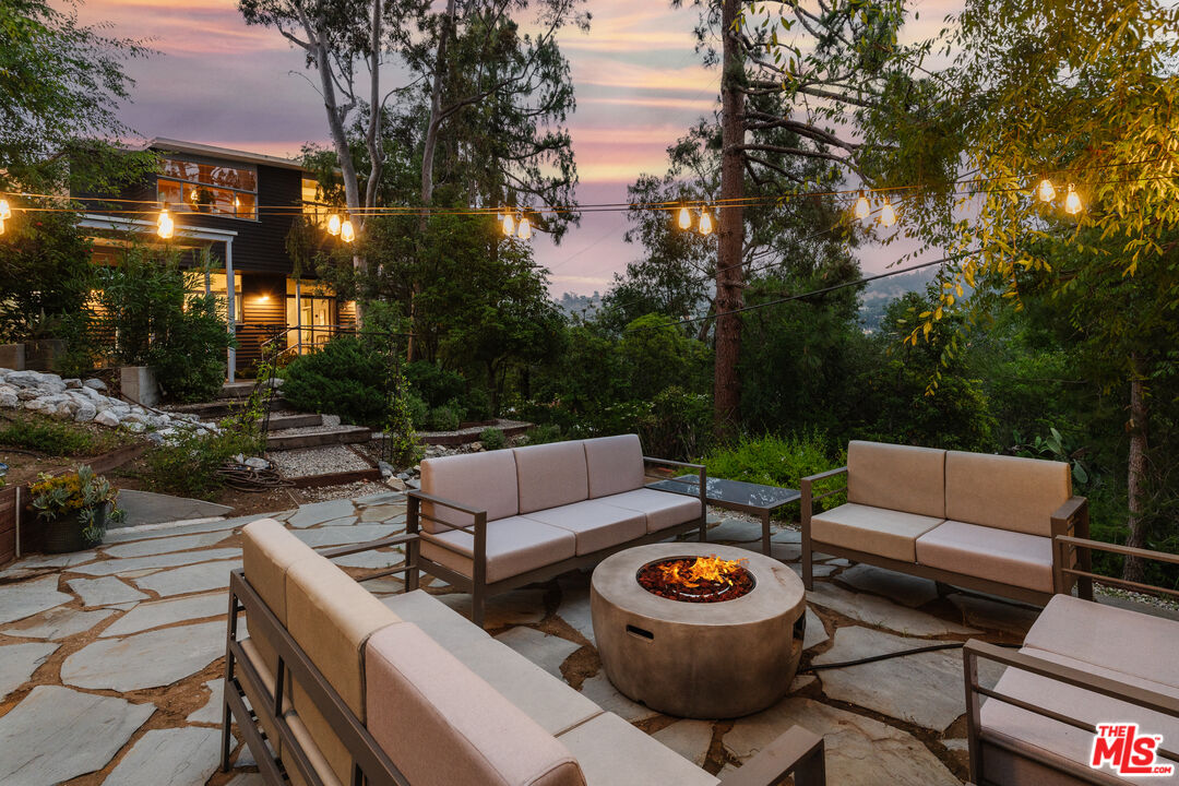 2980 Edgewick Road Glendale, CA 91206 - Photo 2 of 34 a view of a patio with couches and a fire pit and a fire pit