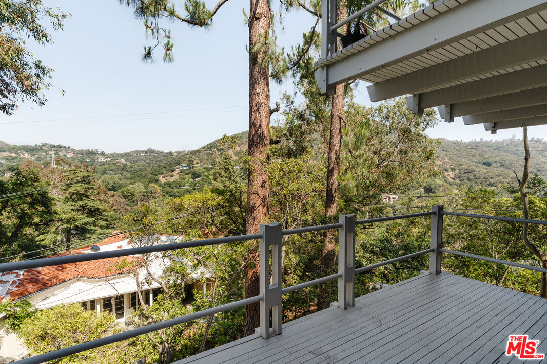 2980 Edgewick Road Glendale, CA 91206 - Photo 22 of 34 a view of a balcony with wooden floor and fence