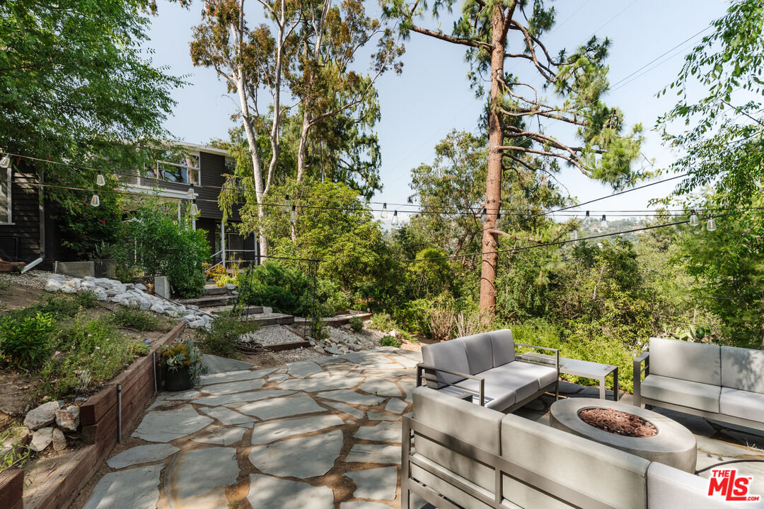 2980 Edgewick Road Glendale, CA 91206 - Photo 28 of 34 a view of a patio with couches chairs and a fire pit