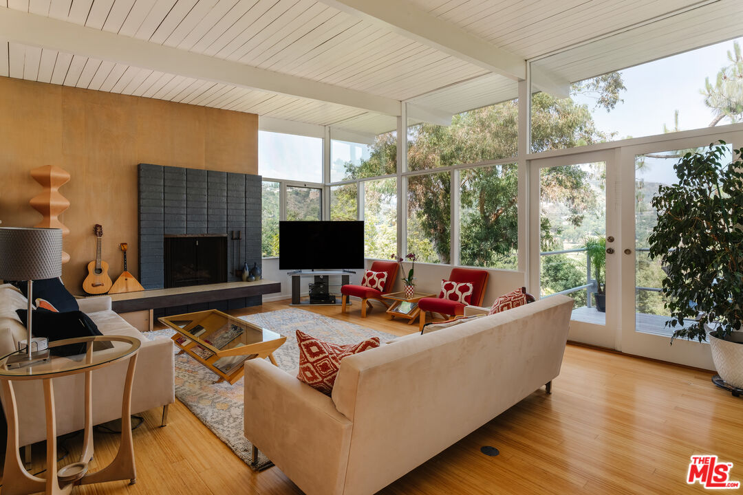 2980 Edgewick Road Glendale, CA 91206 - Photo 6 of 34 a living room with furniture fireplace and flat screen tv