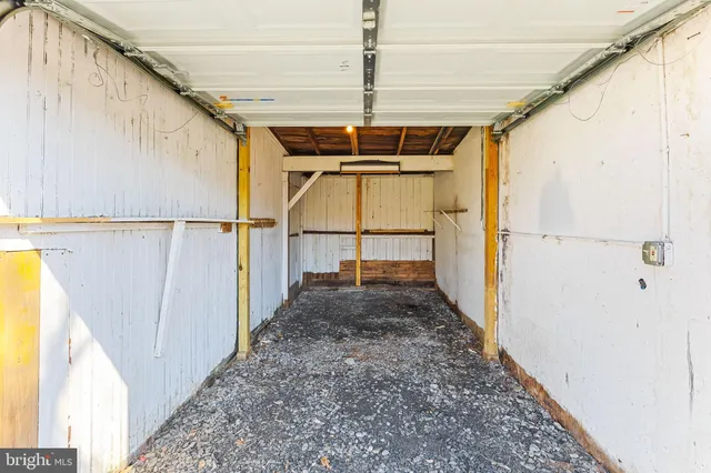 a view of a pathway of a house with wooden floor