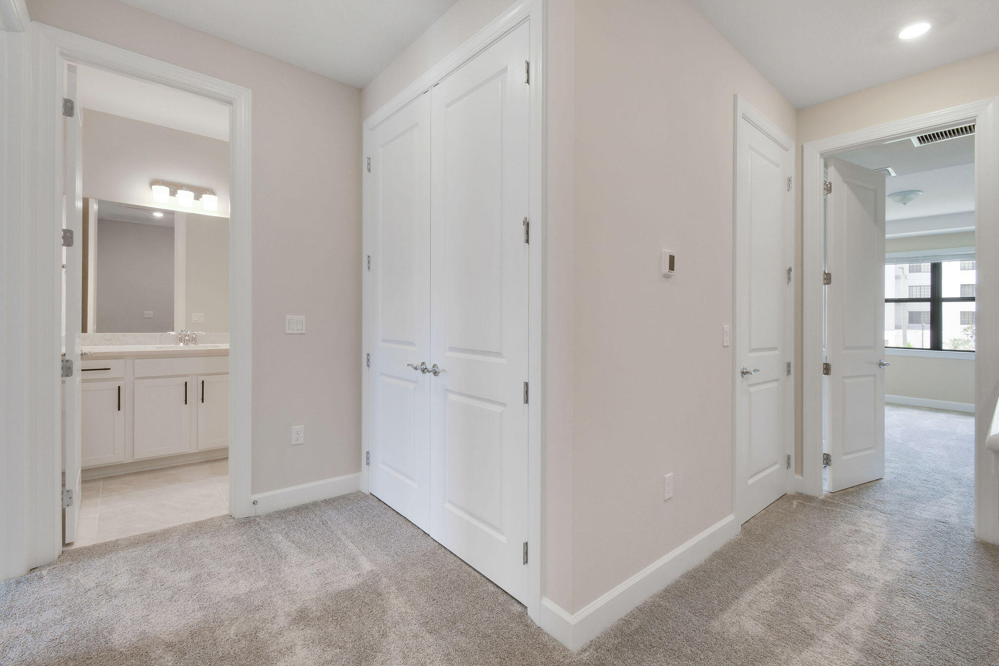 276 Southwest Sally Way, Unit LATITUDE 6613 Stuart, FL 34997 - Photo 12 of 22 an empty room with windows and bathroom