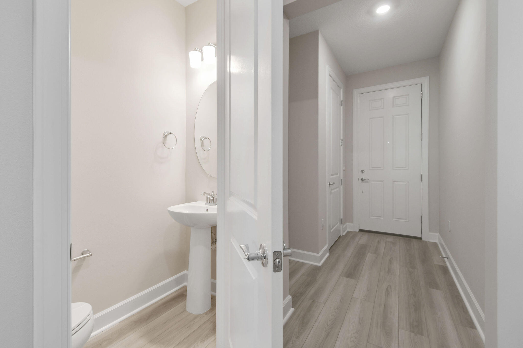 276 Southwest Sally Way, Unit LATITUDE 6613 Stuart, FL 34997 - Photo 15 of 22 wooden floor with a mirror