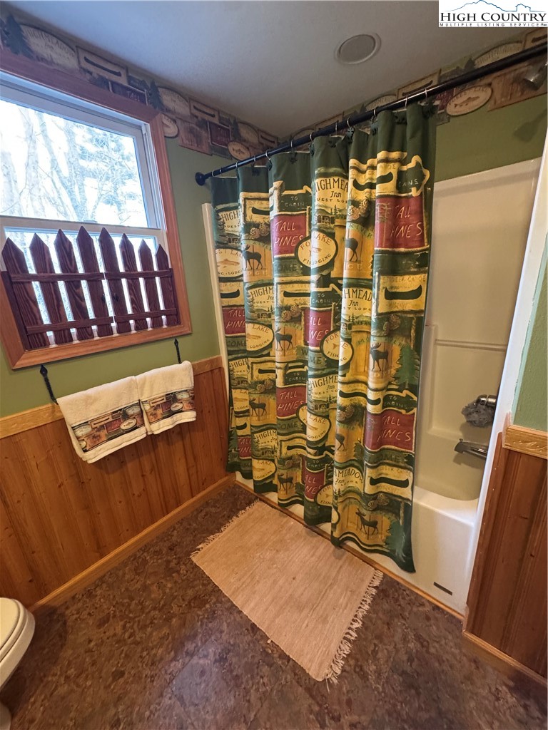 128 Hillcrest Road Newland, NC 28657 - Photo 19 of 37 a view of walk in closet with clothes and shoes