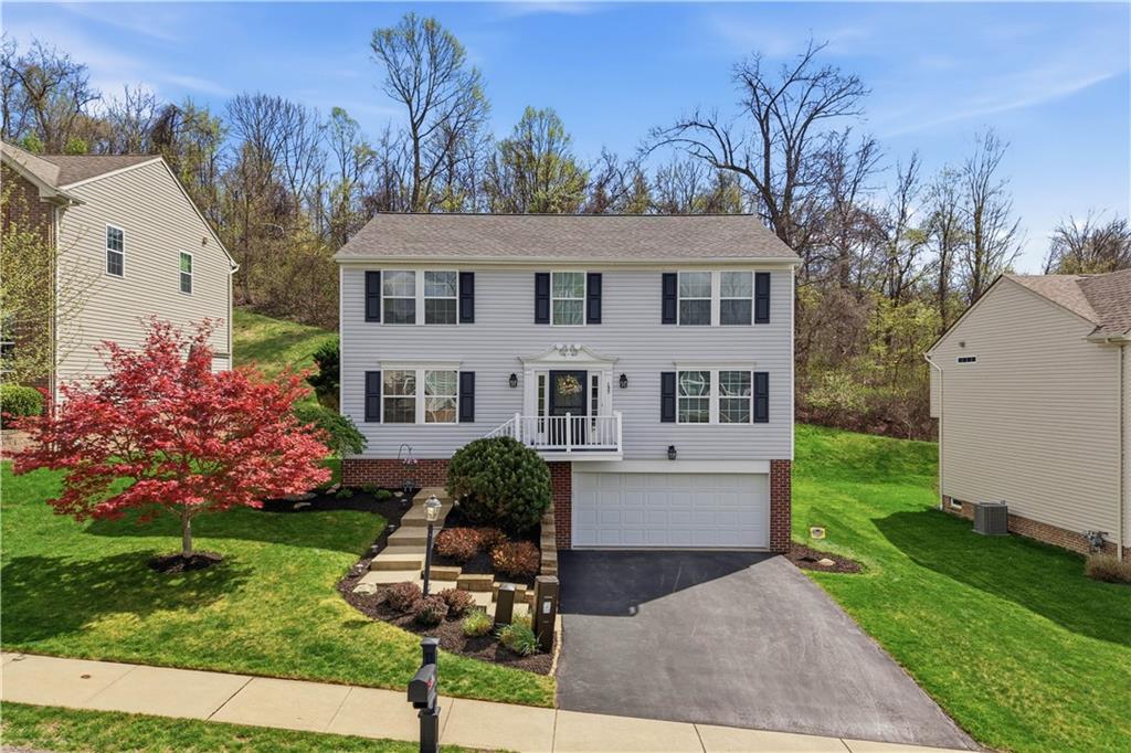 155 Broadstone Drive Mars, PA 16046 - Photo 1 of 30 a front view of a house with garden