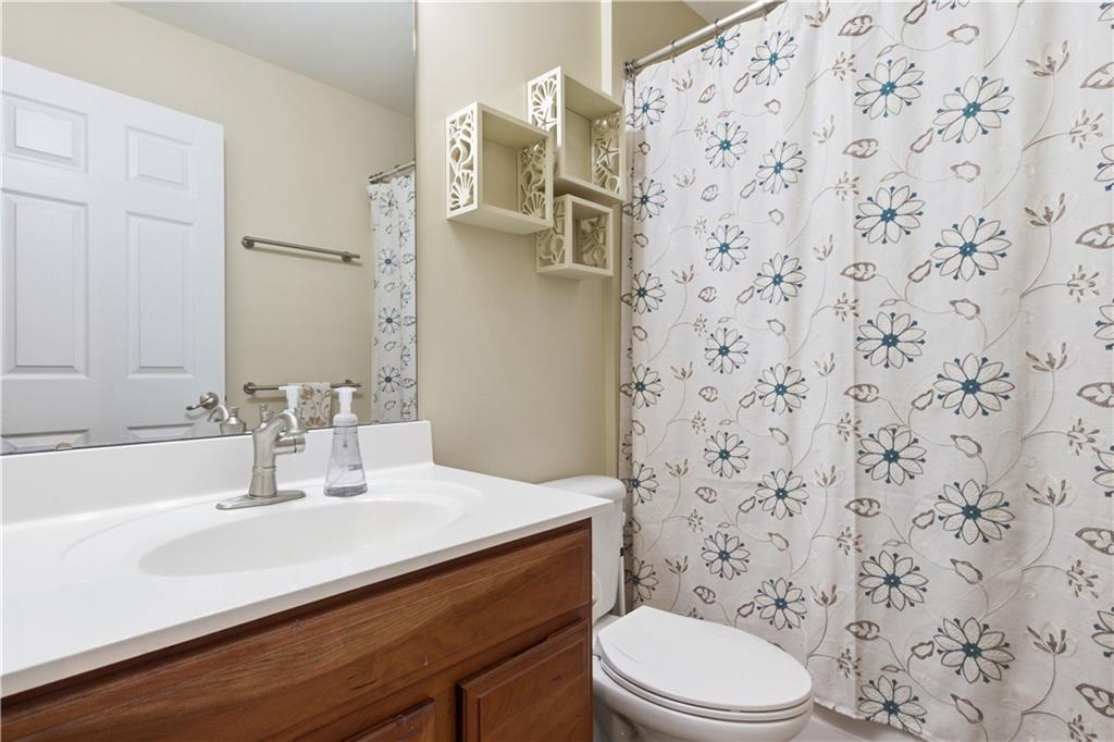 155 Broadstone Drive Mars, PA 16046 - Photo 20 of 30 a bathroom with a sink a toilet and shower curtain