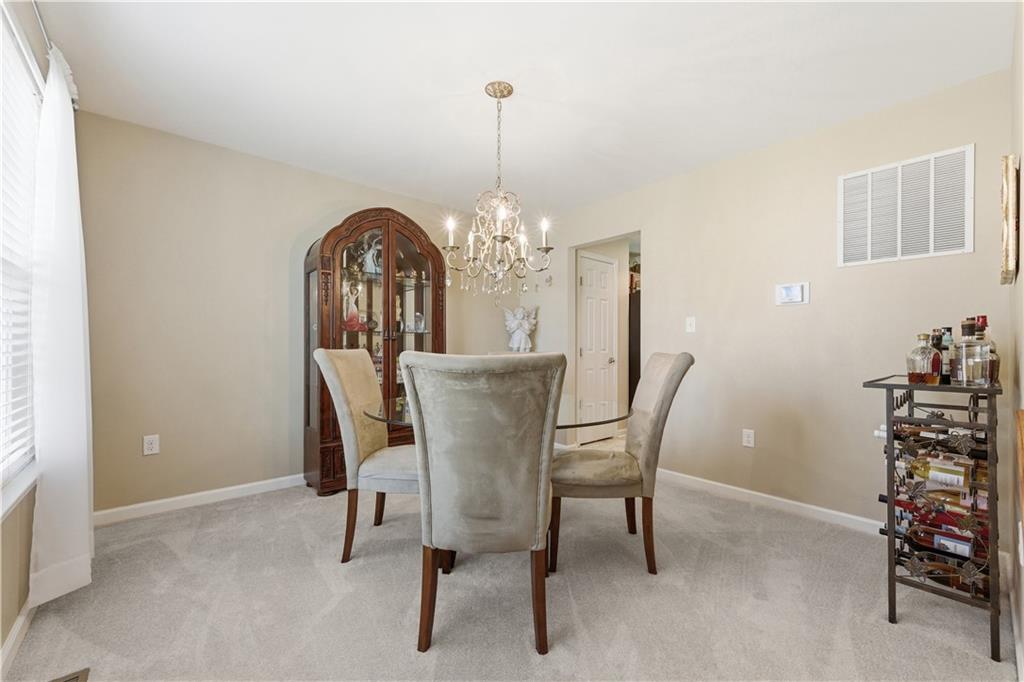 155 Broadstone Drive Mars, PA 16046 - Photo 7 of 30 a view of a dining room with furniture and chandelier