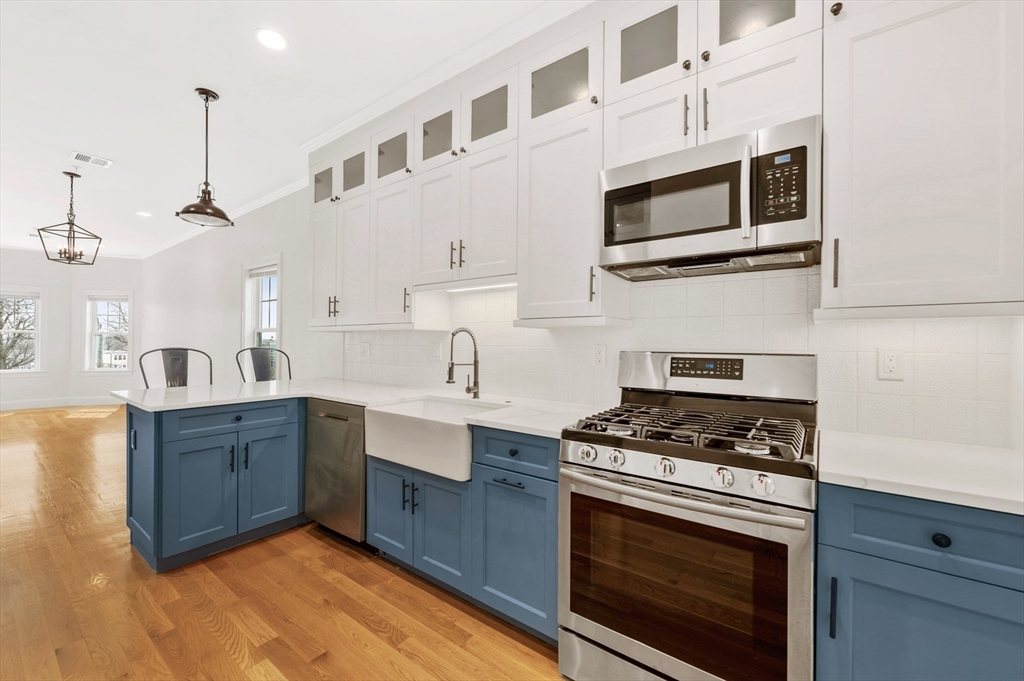 6 Marie Street, Unit 3 Boston, MA 02122 - Photo 1 of 25 a kitchen with stainless steel appliances a stove a sink and cabinets