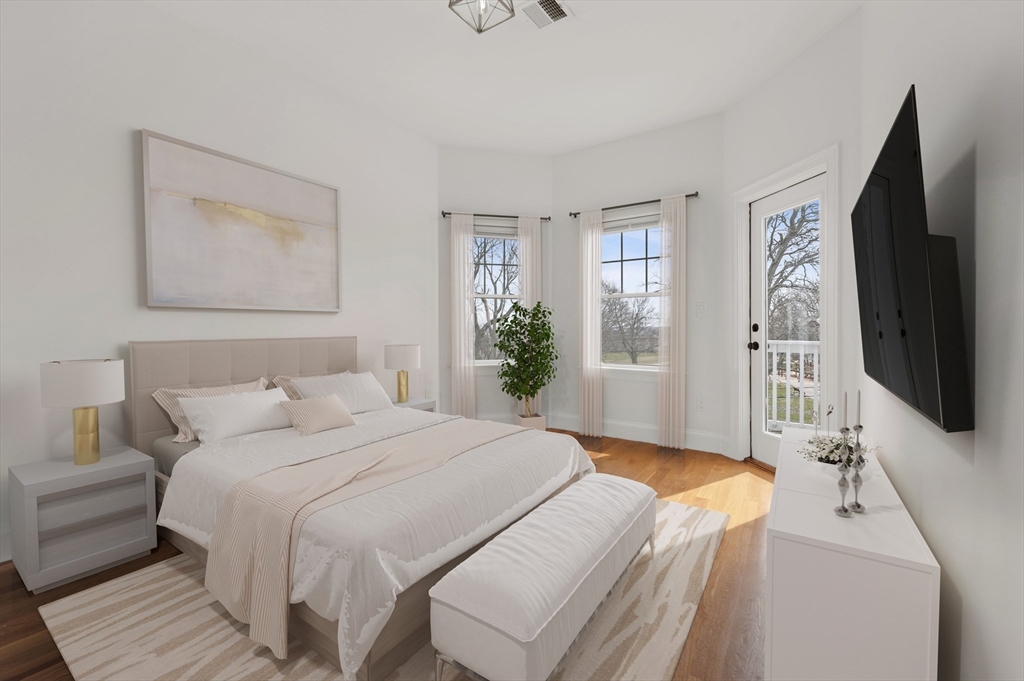 6 Marie Street, Unit 3 Boston, MA 02122 - Photo 11 of 25 a bedroom with a bed and a flat screen tv