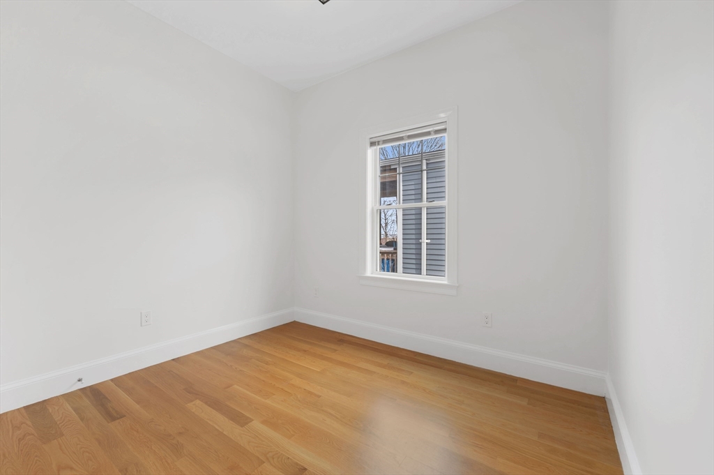 6 Marie Street, Unit 3 Boston, MA 02122 - Photo 15 of 25 an empty room with a window