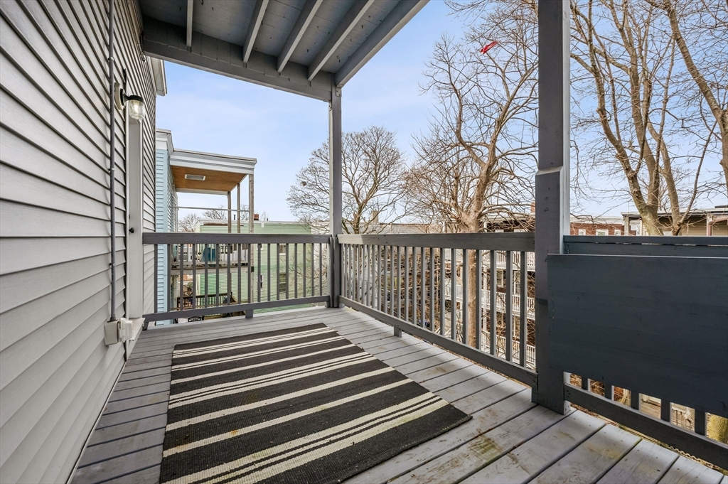 6 Marie Street, Unit 3 Boston, MA 02122 - Photo 21 of 25 a view of a balcony with wooden floor