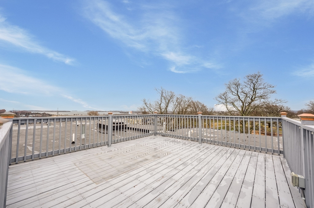 6 Marie Street, Unit 3 Boston, MA 02122 - Photo 22 of 25 a view of balcony with wooden floor