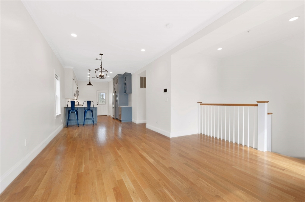 6 Marie Street, Unit 3 Boston, MA 02122 - Photo 7 of 25 a view of empty room with wooden floor