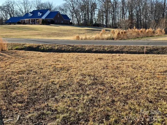 a view of a backyard of the house