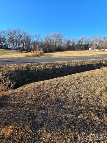 a view of an ocean beach and mountain