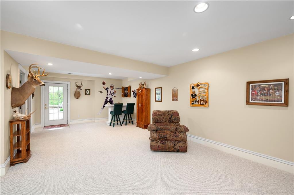 829 Hartzell School Road New Brighton, PA 15066 - Photo 29 of 50 a living room with furniture and a flat screen tv