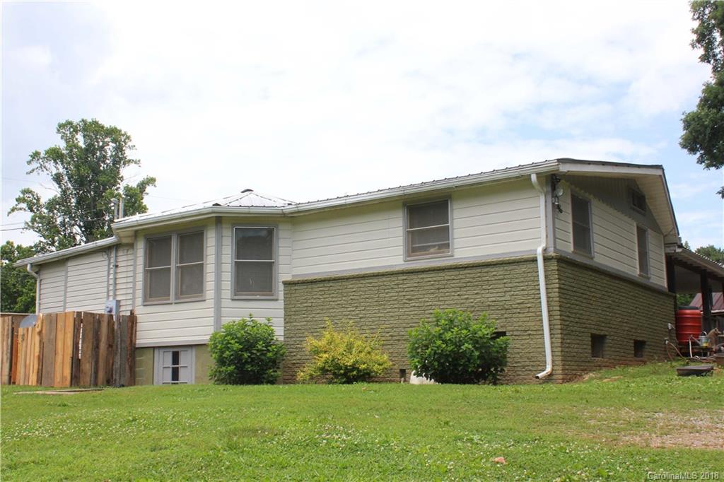 214 Huffman Road Clyde, NC 28721 - Photo 1 of 24 a front view of a house with a yard