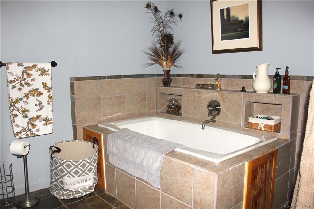 214 Huffman Road Clyde, NC 28721 - Photo 13 of 24 a room with a table and chairs
