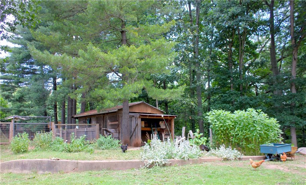 214 Huffman Road Clyde, NC 28721 - Photo 22 of 24 a view of a house with a yard