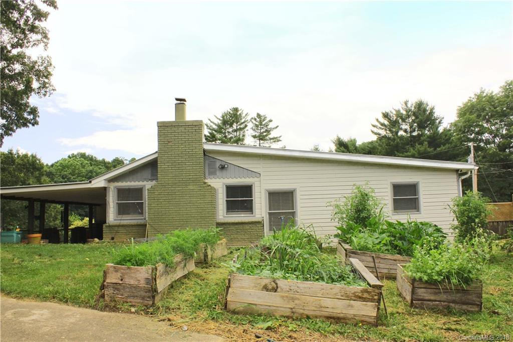 214 Huffman Road Clyde, NC 28721 - Photo 23 of 24 a front view of a house with a yard