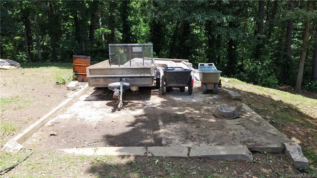 214 Huffman Road Clyde, NC 28721 - Photo 24 of 24 a view of a patio with a table and chairs