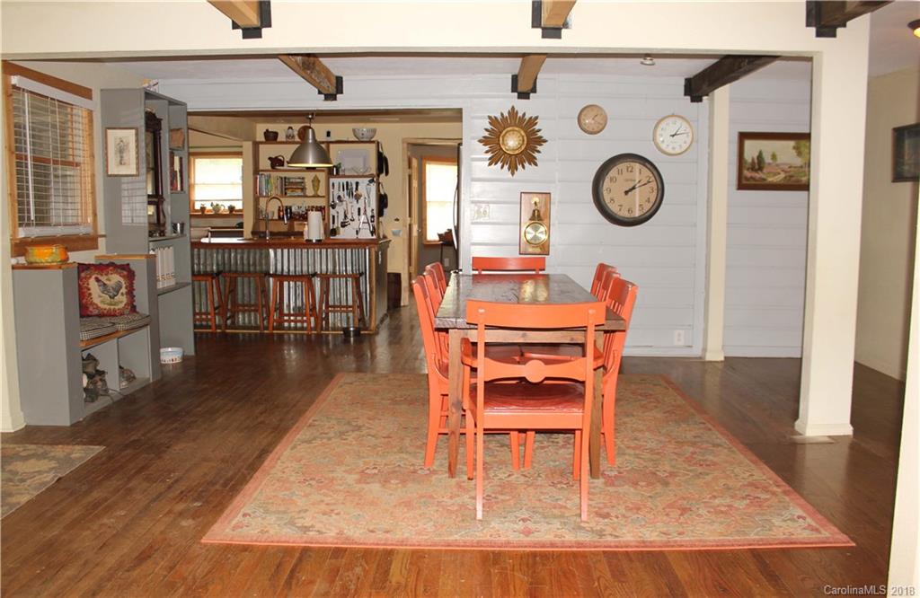 214 Huffman Road Clyde, NC 28721 - Photo 6 of 24 a dining room with furniture and wooden floor