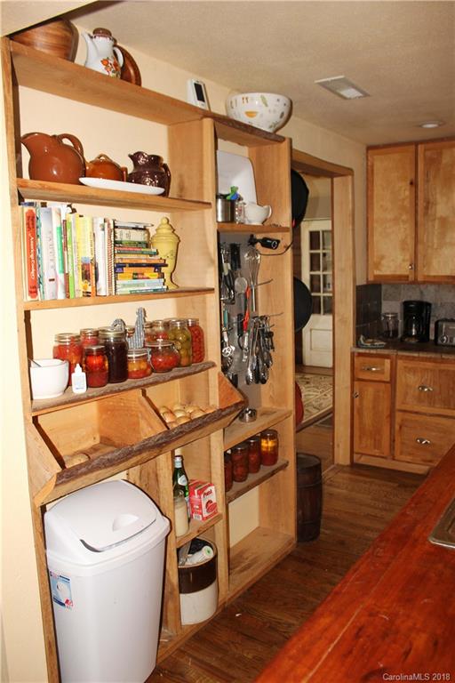 214 Huffman Road Clyde, NC 28721 - Photo 8 of 24 a room with stainless steel appliances a stove a sink and a refrigerator