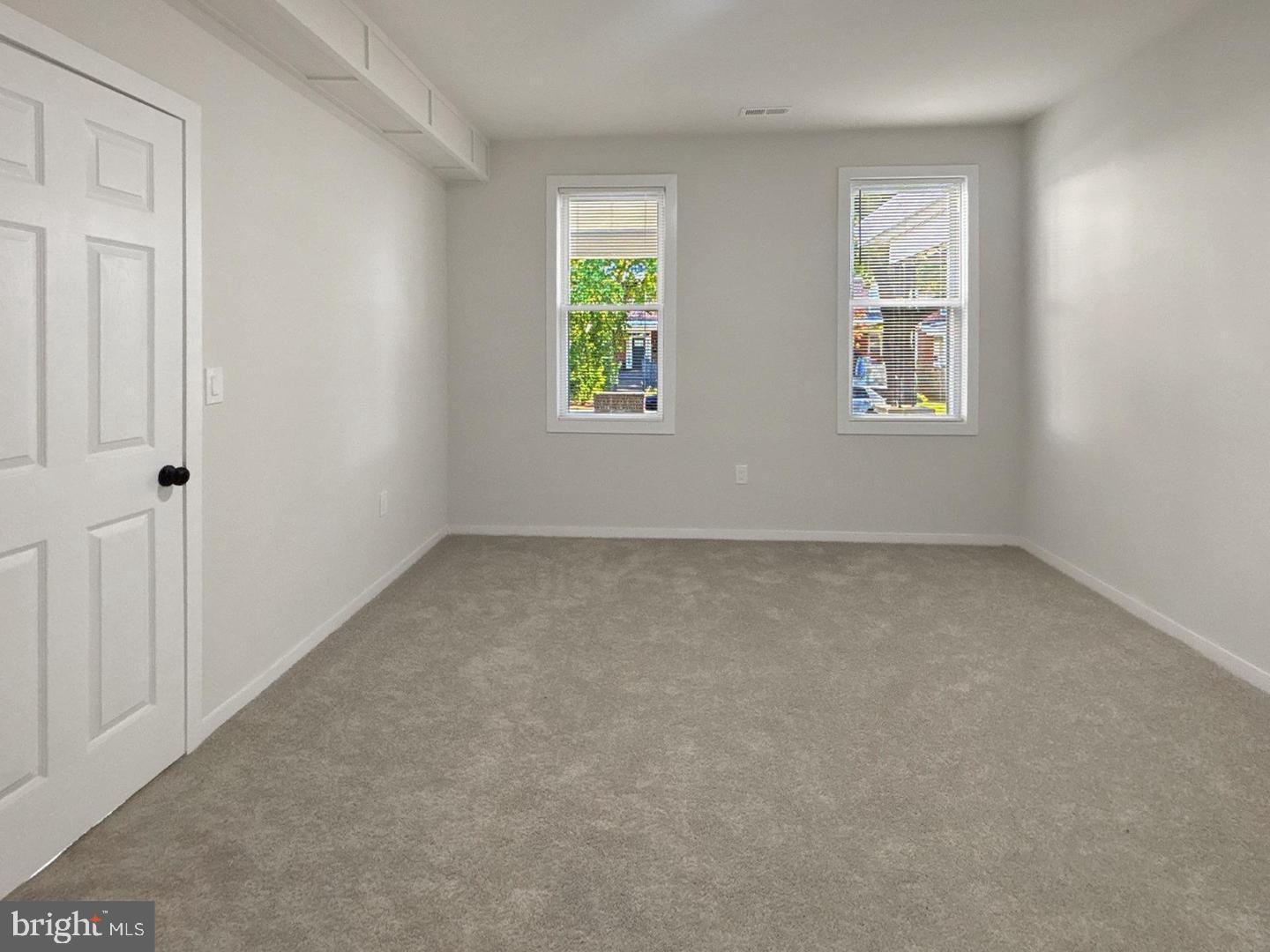2306 Wichita Avenue Baltimore, MD 21215 - Photo 9 of 18 an empty room with windows