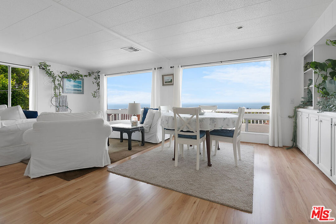29500 Heathercliff Road, Unit 252 Malibu, CA 90265 - Photo 14 of 65 a living room with furniture and wooden floor