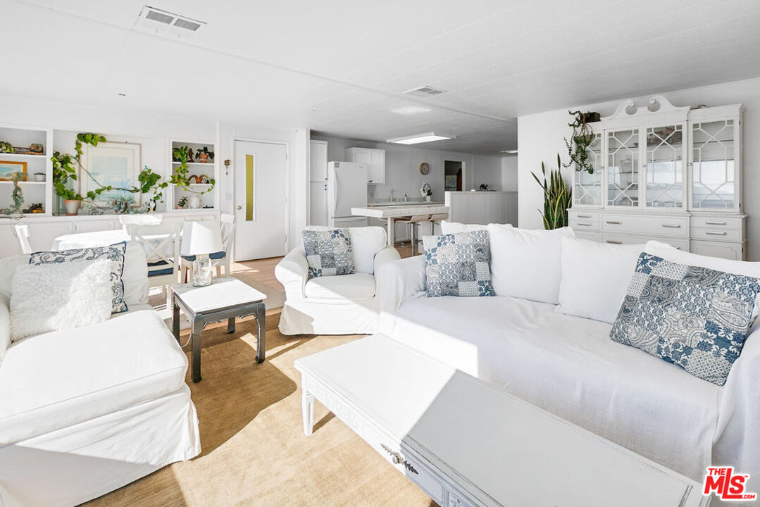 29500 Heathercliff Road, Unit 252 Malibu, CA 90265 - Photo 19 of 65 a living room with furniture and a large window