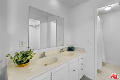 an empty room with a empty space and windows