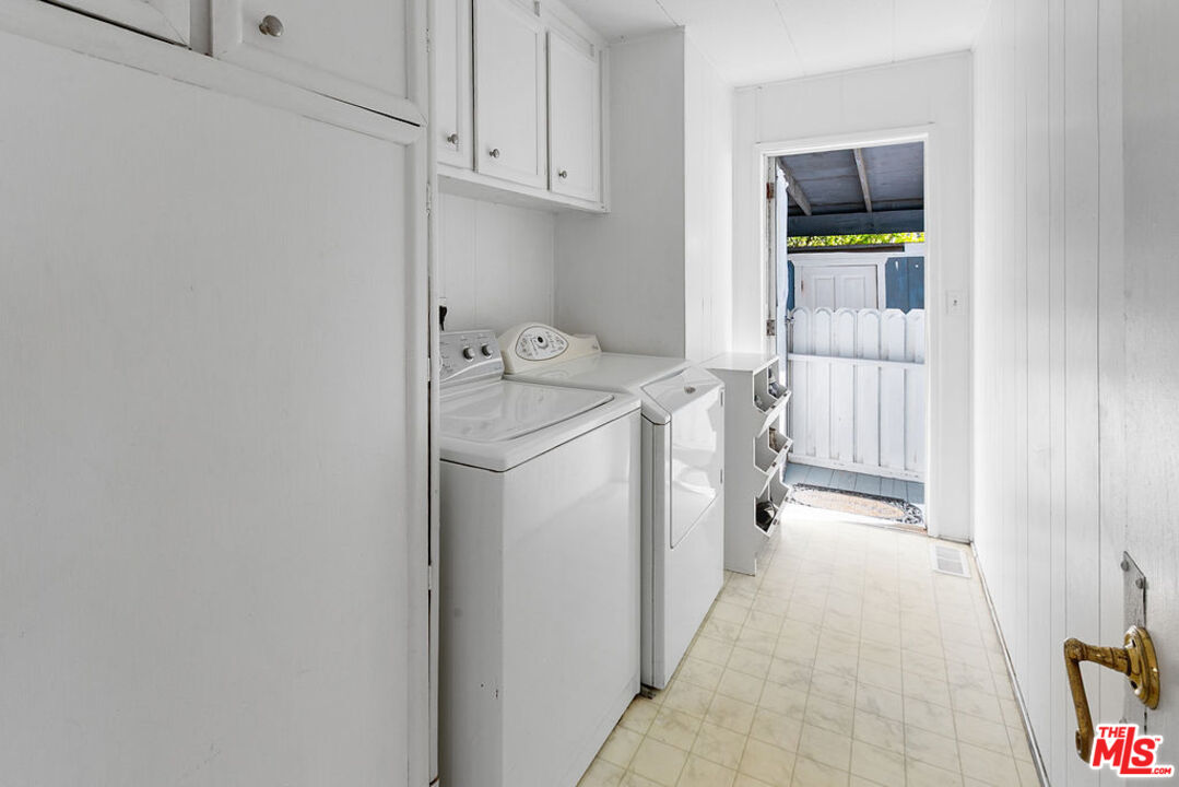 29500 Heathercliff Road, Unit 252 Malibu, CA 90265 - Photo 30 of 65 a utility room with dryer and washer