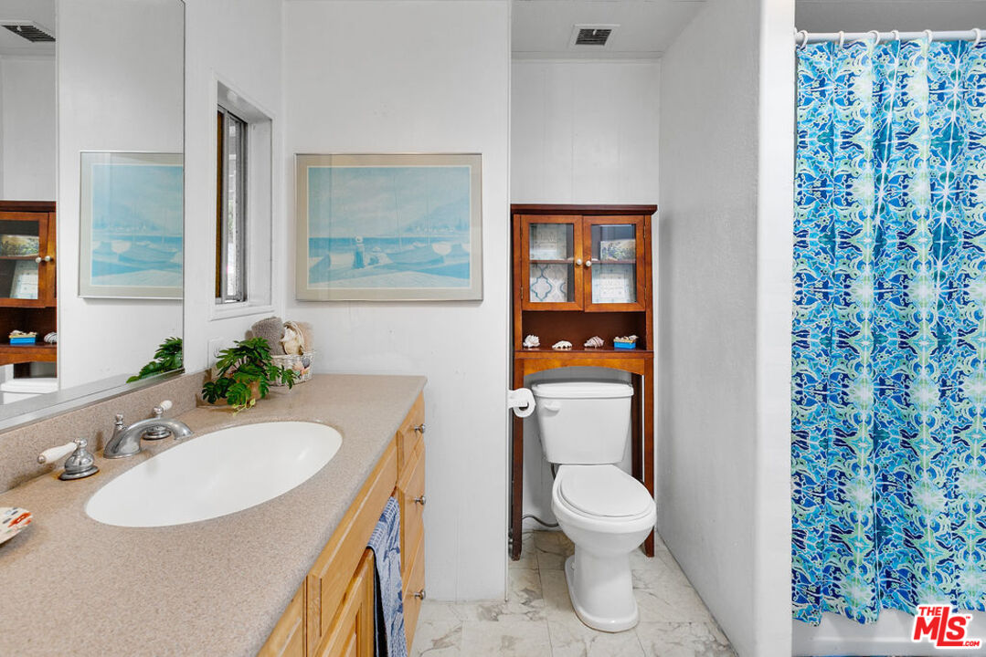 29500 Heathercliff Road, Unit 252 Malibu, CA 90265 - Photo 33 of 65 a bathroom with a sink toilet and shower