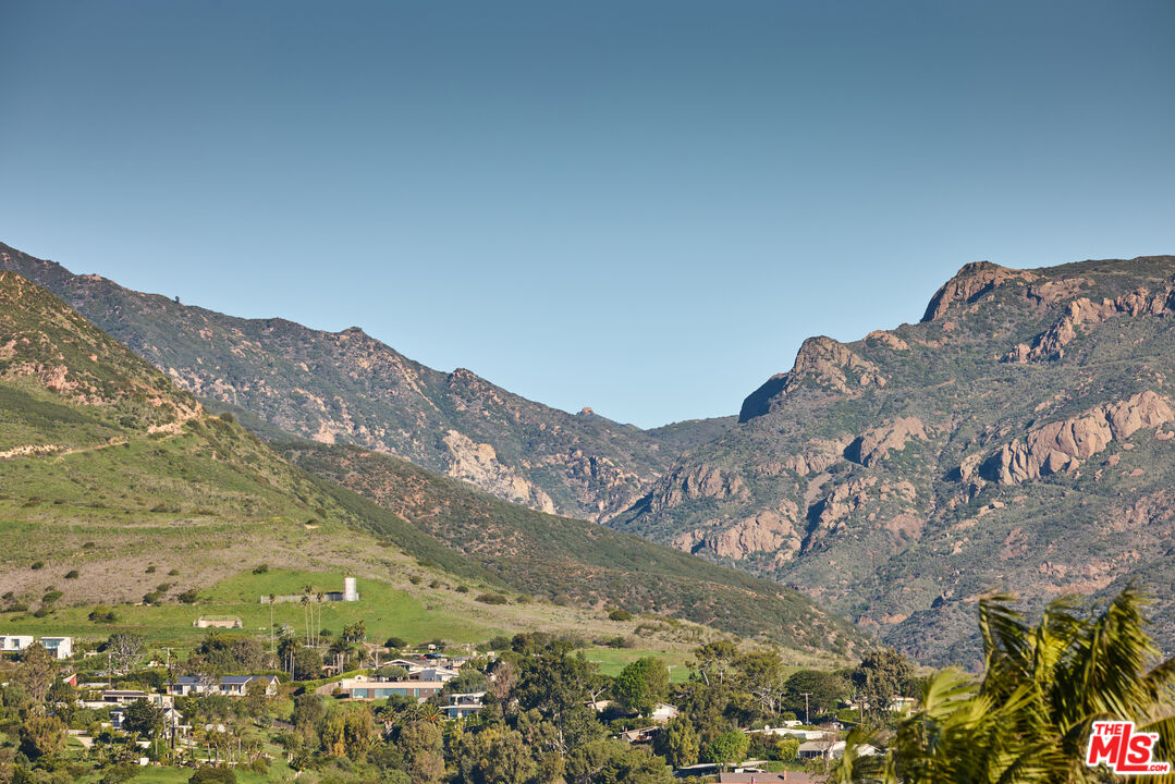 29500 Heathercliff Road, Unit 252 Malibu, CA 90265 - Photo 38 of 65 a view of a mountain range in a cloudy sky