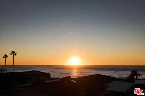 a view of an ocean and a mountain