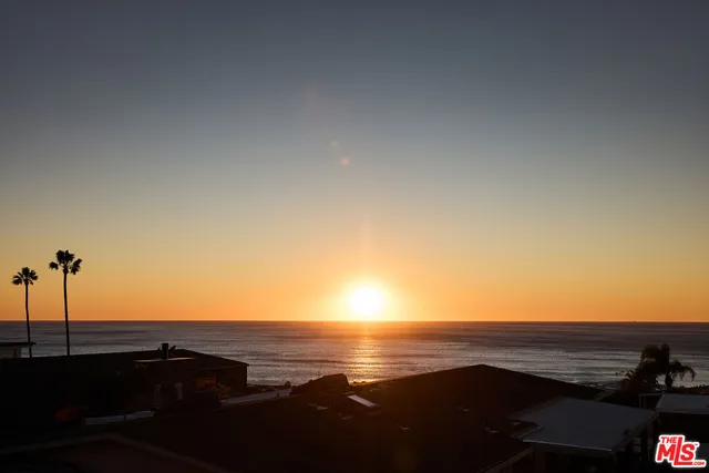 a view of an ocean and a mountain
