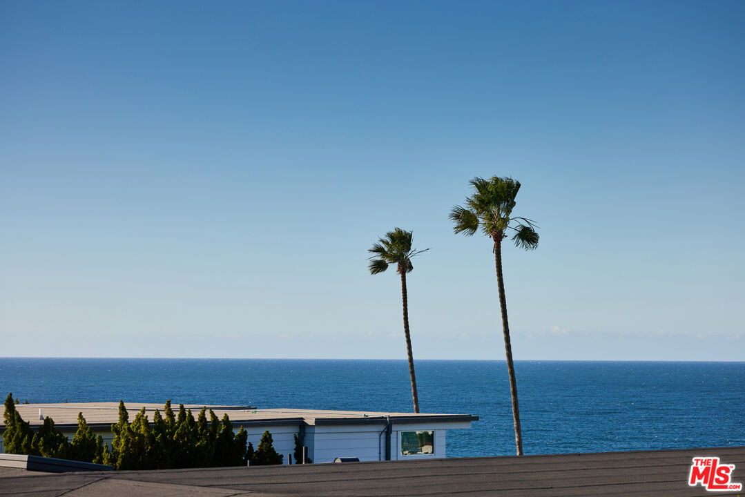 29500 Heathercliff Road, Unit 252 Malibu, CA 90265 - Photo 5 of 65 a front view of a house with a garden