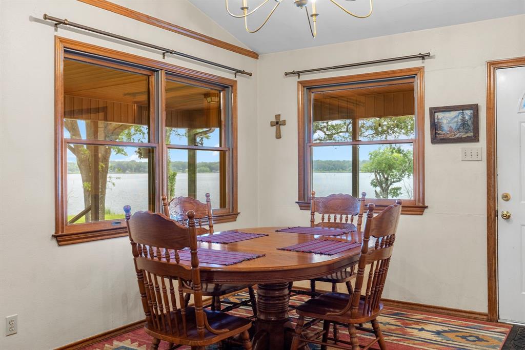 476 Private Road 7326 Emory, TX 75440 - Photo 24 of 33 a view of a dining room with furniture large windows and wooden floor