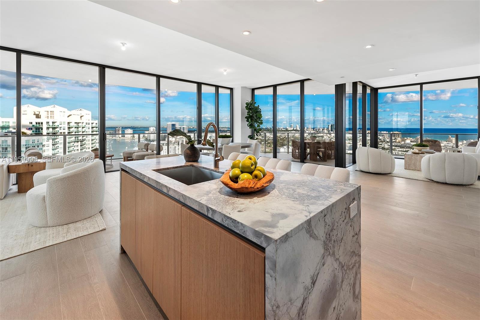 a kitchen with kitchen island a large window in it