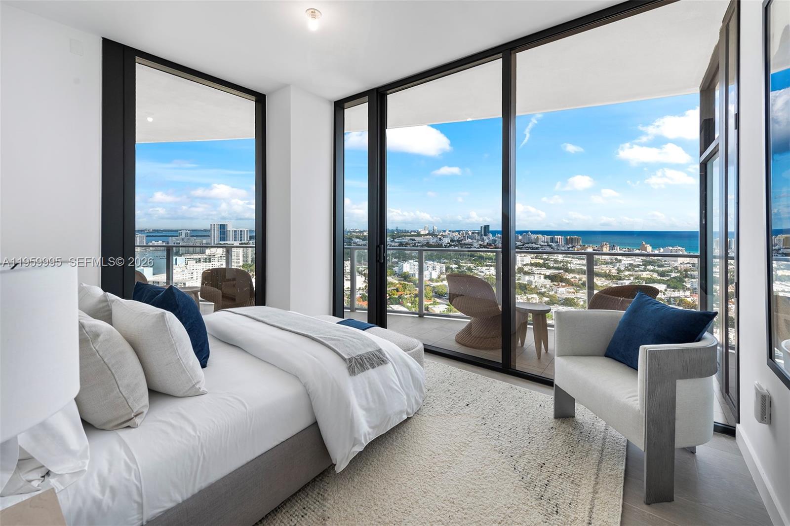 500 Alton Road, Unit 2903 Miami Beach, FL 33139 - Photo 12 of 52 a bedroom with furniture and a large window