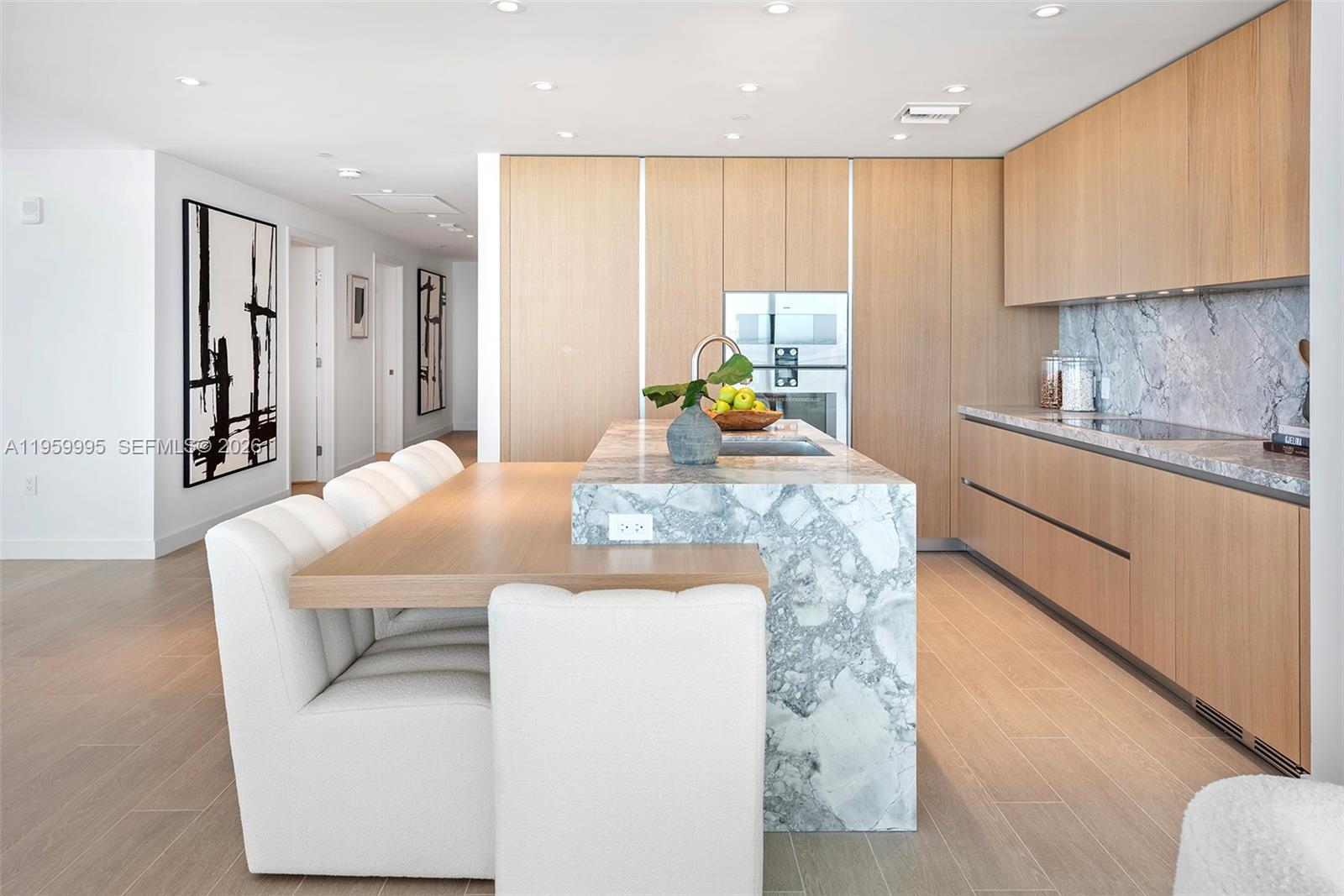 500 Alton Road, Unit 2903 Miami Beach, FL 33139 - Photo 20 of 52 a kitchen with kitchen island granite countertop a sink a stove a oven a counter top space and cabinets