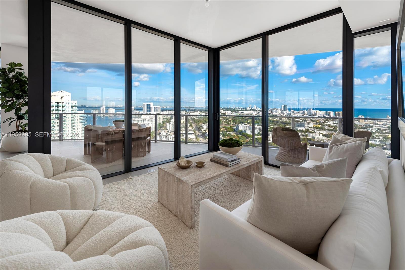 500 Alton Road, Unit 2903 Miami Beach, FL 33139 - Photo 23 of 52 a living room with furniture city view and a floor to ceiling window