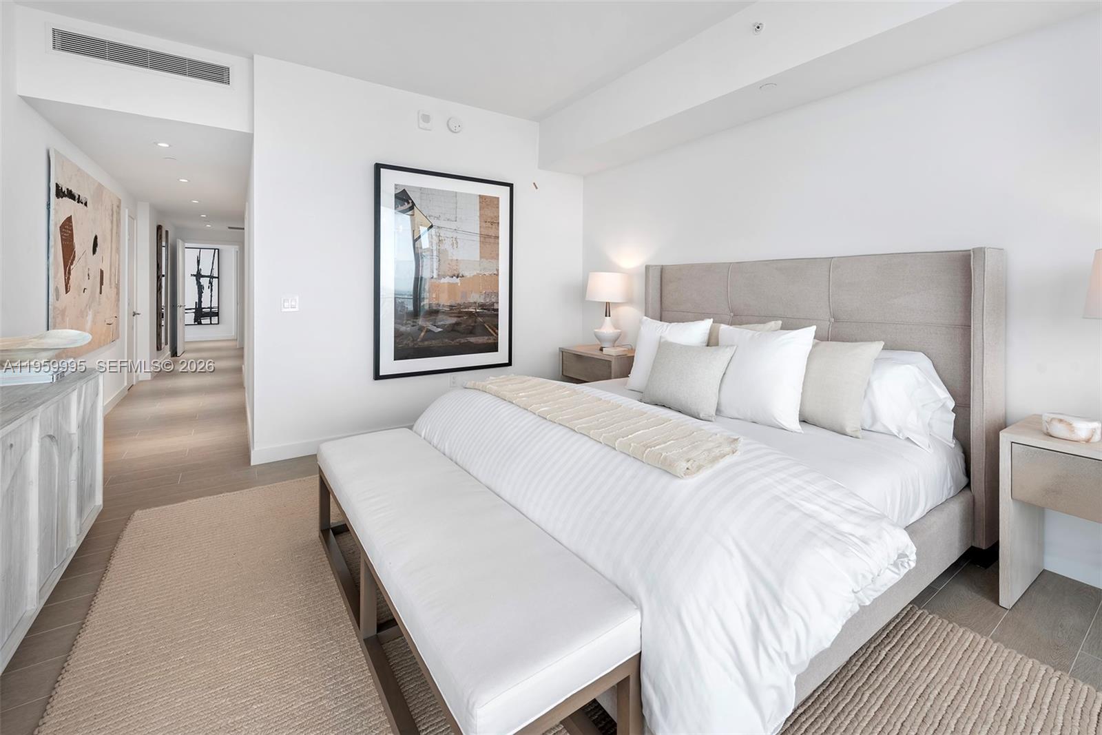 500 Alton Road, Unit 2903 Miami Beach, FL 33139 - Photo 31 of 52 a bedroom with a bed and a lamp on table