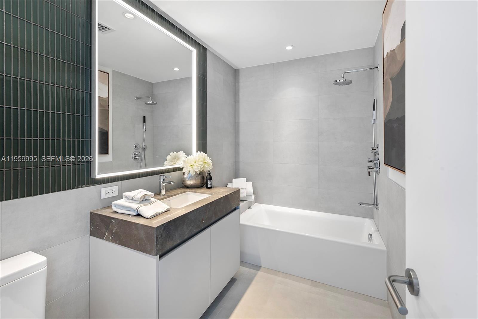 500 Alton Road, Unit 2903 Miami Beach, FL 33139 - Photo 41 of 52 a bathroom with a bathtub sink and toilet