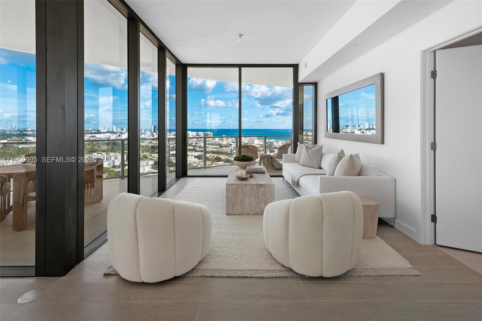 500 Alton Road, Unit 2903 Miami Beach, FL 33139 - Photo 6 of 52 a living room with furniture and floor to ceiling window