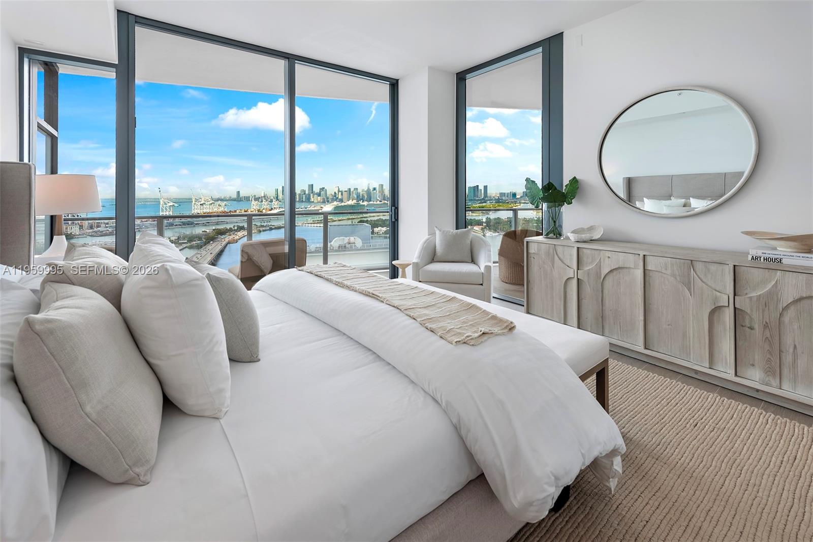 500 Alton Road, Unit 2903 Miami Beach, FL 33139 - Photo 10 of 52 a large bedroom with a large bed and a large window