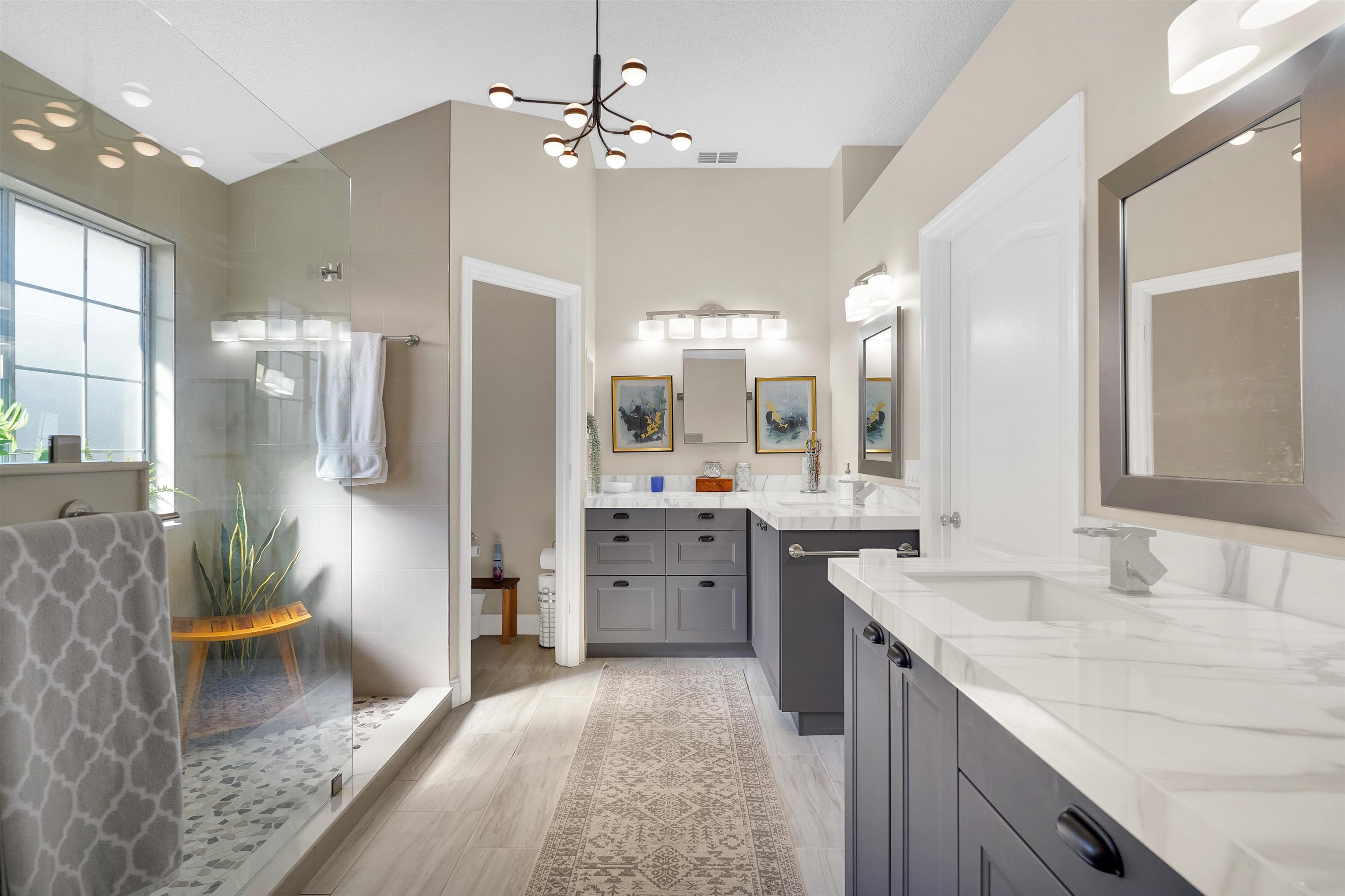 321 Mystical Way St. Augustine, FL 32080 - Photo 23 of 46 Full bath featuring two vanities, suspended lighting, walk in shower, and light wood-type flooring